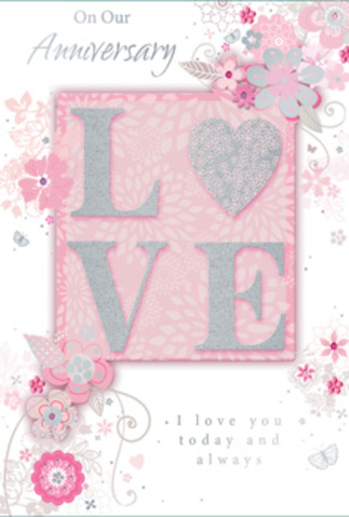 The anniversary card in this image is presented like a cherished keepsake laid on a tidy Bayswater table, glowing softly under gentle indoor light. Dominating the centre is the word "LOVE," printed in large, graceful capitals that rise slightly from the card's surface. Each letter is coated with a frosted, glitter-like finish-more of a soft shimmer than a sparkle-so that when light brushes across, it catches at the edges, creating a subtle, playful dance of highlights. Around this central motif, fine hand-drawn florals meander organically along the borders, as though a florist had sketched a border for a romantic bouquet destined for a doorstep near Leinster Gardens. The flowers are small and airy, with petals in shades of pink, lilac, and creamy ivory, layered over a translucent blush wash that keeps the entire design light. Wispy sprays, tendrils, and filigree-like curves connect the blossoms, with tiny leaves and near-hidden butterflies fluttering through the pattern. These details are picked out in a mix of soft grey and faint silver accents, resembling the sheen of satin ribbon threaded through pastel blooms. The card's background is a gentle, even pink that brightens slightly around the lettering, drawing the eye and suggesting warmth and constancy. Nestled beneath or beside the floral motif, the words "I love you today and always" appear in understated, elegant type, like a whispered promise preserved on paper. Altogether, the design feels like a quiet, hand-tied bouquet translated into print: refined, romantic, and ideal for marking a longstanding love story in Bayswater.